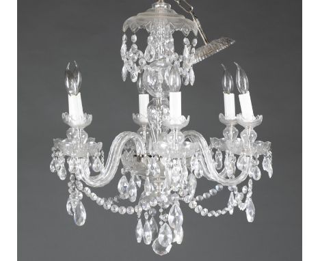 Six light electric crystal chandelier. 20th century. Hanging oval and teardrop shape crystals from each light and string of c