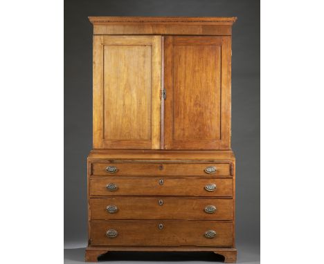 A Federal style secretary desk. 19th century. Cornice with dentils. Double-door opens to cabinet with top drawer beneath corn