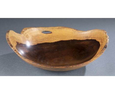 A Barry Biesanz (b. 1948) Cocobolo turned wood bowl. Costa Rica. 1994. Ovular shaped bowl with lighter and darker cocobolo wo