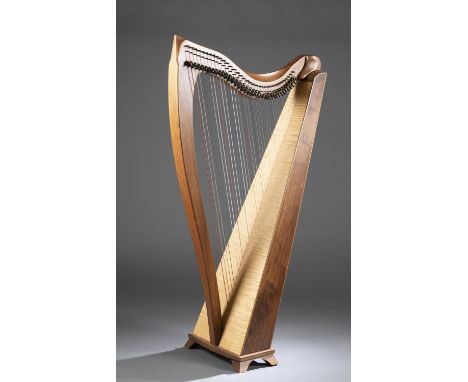 A Dusty Strings lever harp. Model FH-36B. 1991. 36 strings, five octaves. Square back. 54" x 29 1/2" x 16". Shipping: This lo