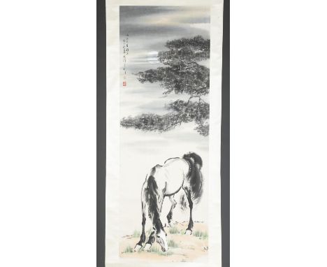 A Chinese scroll painting in the style of Xu Beihong (Chinese, 1895-1953). Watercolor and ink on paper. Depicting a horse gra