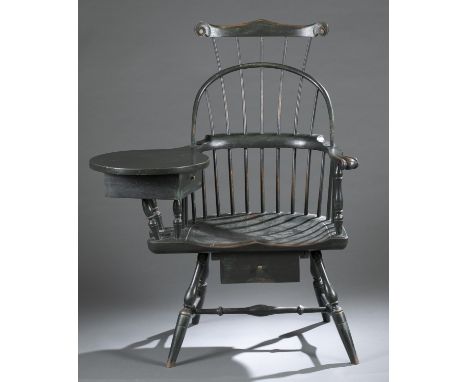 A reproduction Windsor triple-back writing arm chair. 21st century. Triple comb-back spindle chair with right arm writing boa