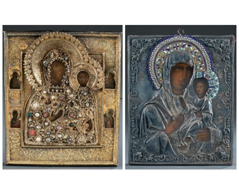 A group of two Russian icons of the Iverskaya Mother of God in oklads. 19th/20th century. Tempera on panel. ++ Gilt silver to