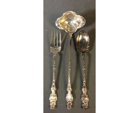 A group of three Whiting Manufacturing "Lily" pattern, designed by Charles Osborne (1902), serving utensils. Marked on back. 