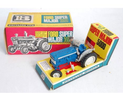 A Britains No. 9527 Ford Super Major 5000 diesel tractor, finished in blue and grey with grey hubs, appears complete with air