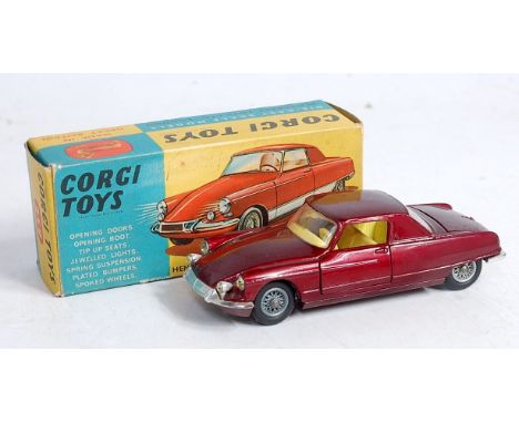 A Corgi Toys No.259 Le Dandy Coupe, comprising metallic dark red body with yellow interior and wirework hubs, with jewelled h