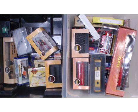 Two boxes containing a collection of various mixed scale public transport and military diecasts to include Corgi, Matchbox Co