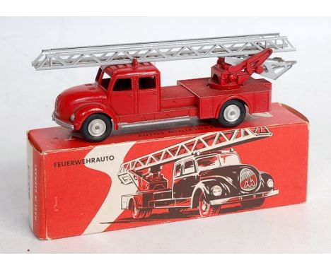 A Marklin No.8023 Marquis fire engine, comprising red body with silver trim and ladder, cast spun hubs, in original all-card 