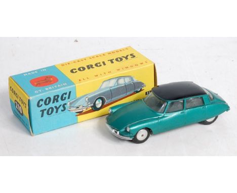 A Corgi Toys No. 210 Citroen DS19 comprising metallic dark green body, with black roof and spun hubs, in the original blue an