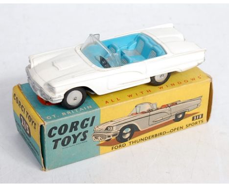 A Corgi Toys 215 Ford Thunderbird open sports car comprising white body with blue interior and spun hubs in the original blue