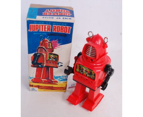 A KO Toys of Japan circa 1960s Jupiter Robot comprising of red and black plastic body with chrome and metal fittings, clockwo