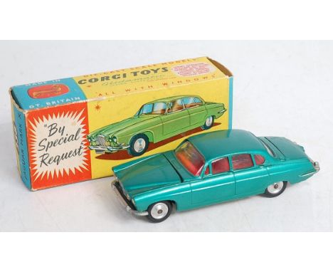 A Corgi Toys No. 238 Jaguar Mk X comprising of metallic sea green body with red interior and spun hubs, in the original all-c