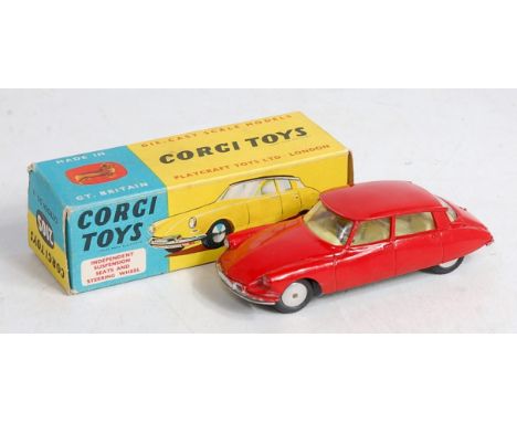 A Corgi Toys No.210S Citroen DS19, comprising red body with lemon interior and spun hubs, in original blue and yellow all-car