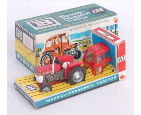 A Britains No. 9529 Massey Ferguson 135 tractor comprising red white and grey body with silver hubs, cab attachment and mule 