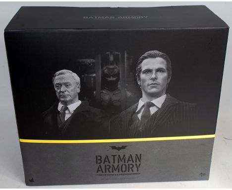 A Hot Toys No. MMS236 1/6 scale collectable Batman Armoury with Bruce Wayne and Alfred Pennyworth, appears as issued in the o