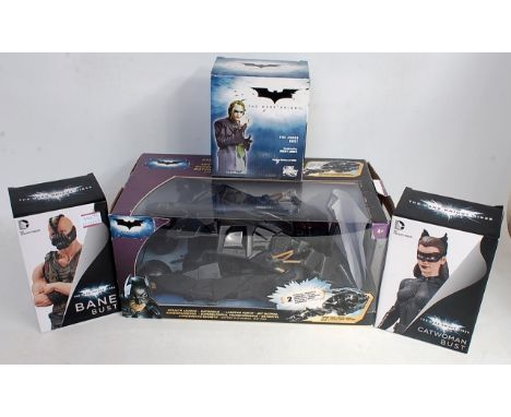 Four various boxed Batman The Dark Knight Rises boxed vehicles and bust figurines, to include DC Comics Catwoman bust, DC Com