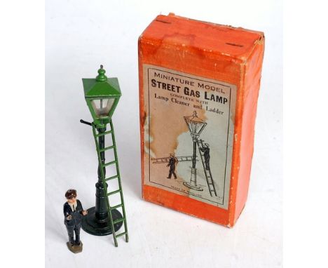A Johilco 1930s miniature model of a street gas lamp, complete with lamp cleaner and ladder, measuring 14cm max height, sold 