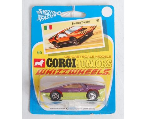 A Corgi Toys Juniors Whizzwheels No. 65 Bertone Carabo comprising metallic purple body with green base plate and red front bu