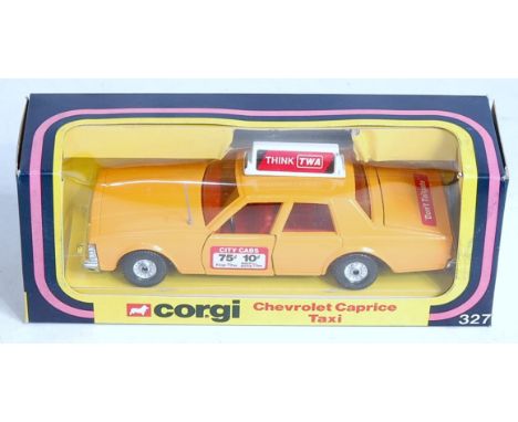 Corgi Toys, 327, Chevrolet Caprice Taxi, comprising yellow body, red interior, with Think TWA Livery, in the original window 