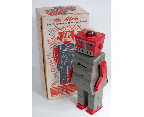 An Advanced Doll &amp; Toy Company of USA 'Mr Atom' plastic robot, comprising of silver and red body with clear domed eyes, s