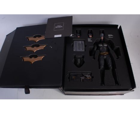 A Hot Toys DX02 1/6 scale collectable figurine of Batman from the Dark Knight series appears complete, in the original brande