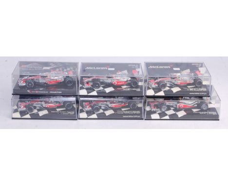 Six various plastic cased Minichamps 1/43 scale Vodafone Maclaren F1 diecasts to include an MP4-24 Lewis Hamilton 2009 and ot