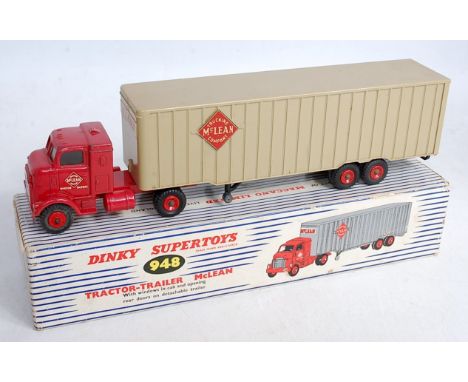 A Dinky Toys No.948 McLean Trucking Company tractor and trailer, comprising red cab with grey back and red plastic hubs, with