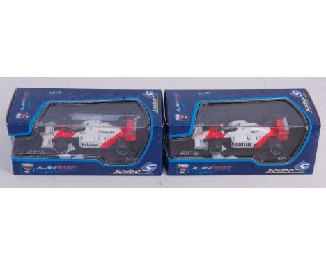 Two boxed Solido Alain Prost Collection, a Maclaren F1 diecast, examples to include a Maclaren F1 MP4/2C 1986 and one other