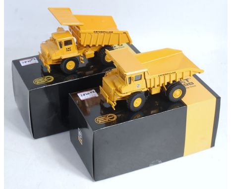 A Cat 769 rear dump truck, 1/48 scale diecast model (NM,BVG); a Cat 769B rear dump truck, 1/48 scale diecast model (with brea