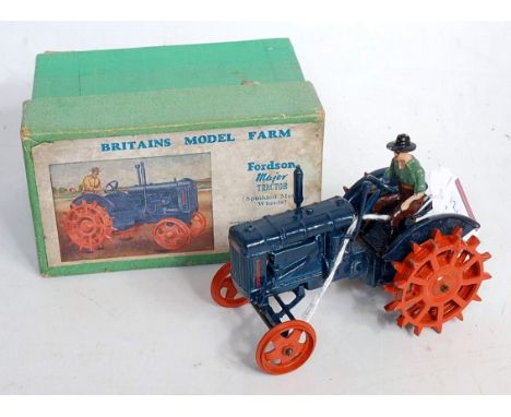 A Britains Farm Series No. 127F Fordson Major tractor with spudded metal wheels comprising blue body with orange wheels and o