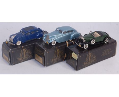 A Brooklin 1.43 scale white metal diecast group to include a DRK7 1934 Chrysler Air Flow, a BRK No. 1 1933 Pearce Arrow Silve