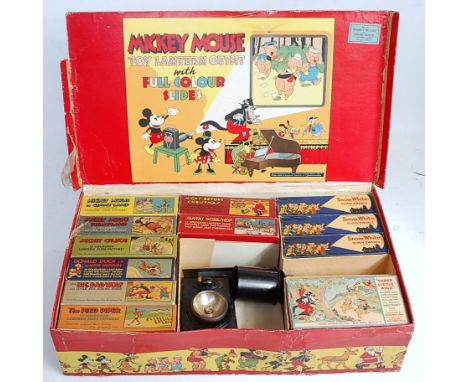 A boxed Mickey Mouse toy lantern set complete with battery operated lantern projector, with 12 various Disney boxed colour sl