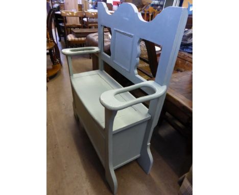 A vintage two seater boot box, painted in a light green, est. 88 x 36 x 103 cms.