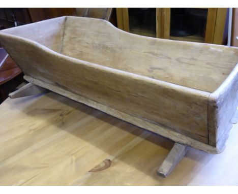 A vintage pine rocking cradle, est. 50 x 35 x 96 cms.