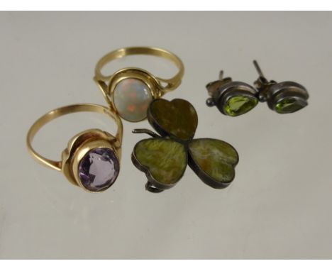 A lady's 9 ct gold amethyst ring, size N together with a lady' 9 ct opal ring, size N, green stone clover brooch and earrings