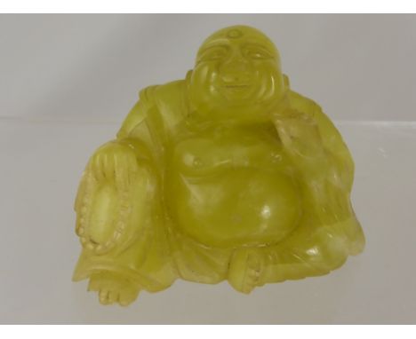 A Chinese Vintage Yellow Stone Carved Figure of a seated Buddha.  9 x 7 cms.