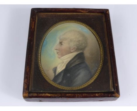 An Oval Miniature Portrait, depicting a Georgian gentleman in profile, presented in a daglio style frame, 10 x 8.5 cms