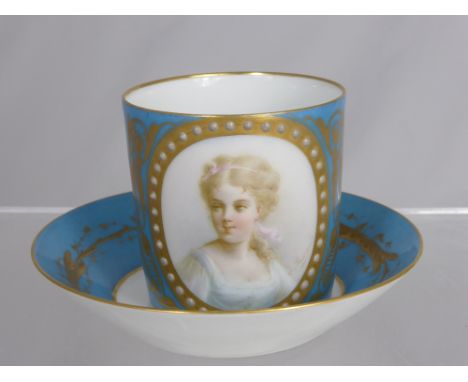 A Sevres 1771 Cabinet Coffee Can and Saucer (marks to base), portrait cartouche of a young girl, signed J Pascault. 