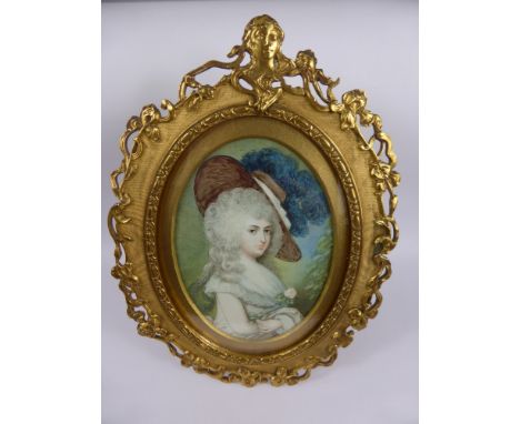 An Oval Portrait Miniature of a Lady, depicting a lady in a feather trimmed hat, the miniature in a French Gilt Frame, stampe