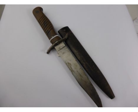 A Vintage Wooden Handle Continental Style Bowie Knife in metal sheath. The blade hilt engraved with knights helmet and crowne