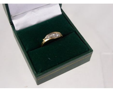 A Lady's Yellow Gold and Diamond Ring, set with five graduated old cut diamonds, size K, approx 2.3 gms.