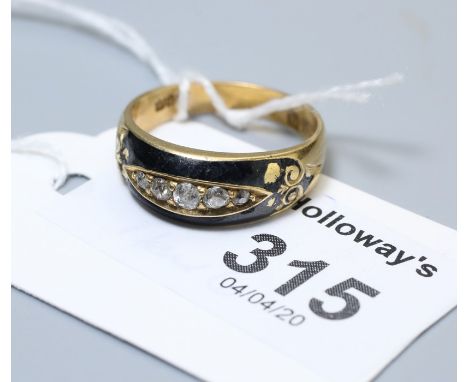 A late Victorian diamond and enamel mourning ring, the five graduated and cut diamonds in engraved and enamelled tapering ban