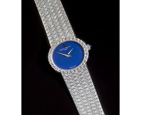 Baume and Mercier, a lady's diamond wristwatch, the midnight blue oval dial with arrow head hands, diamond -set bezel and int