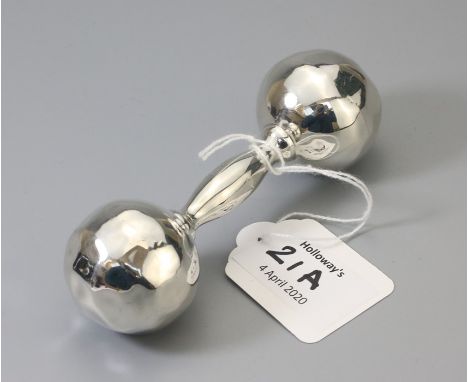 Tiffany. A silver rattle in the form of a dumbbell with textured terminals, signed Tiffany and Co '' Sterling 925''. 11cm len