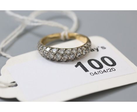 A diamond half hoop ring, composed of three rows of brilliant cut diamonds pavé set to curved band,  Ring size K, 3.2g