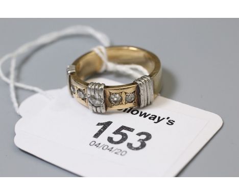 A five stone diamond ring, the gypsy set old brilliant cut diamonds within a bi-coloured shank with three applied vertical ba