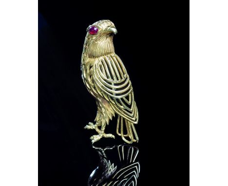 Cartier,  an eagle brooch with cabochon ruby to feathered head, open wire-worked wings, signed Cartier with maker's mark JC, 