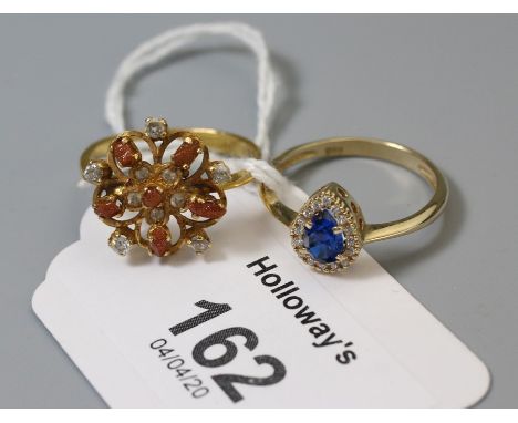 A gem set flower head ring, together with another ring Gross weight 5.6g