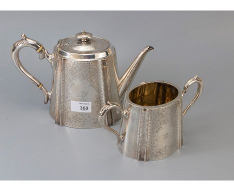 A Victorian silver part tea set, comprising cartouche shaped teapot and sucrier with flat chased decoration, Sheffield 1873, 