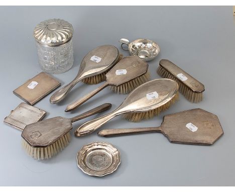 A Victorian silver topped dressing table jar, London 1894, a four piece silver backed dressing table set, two silver backed h